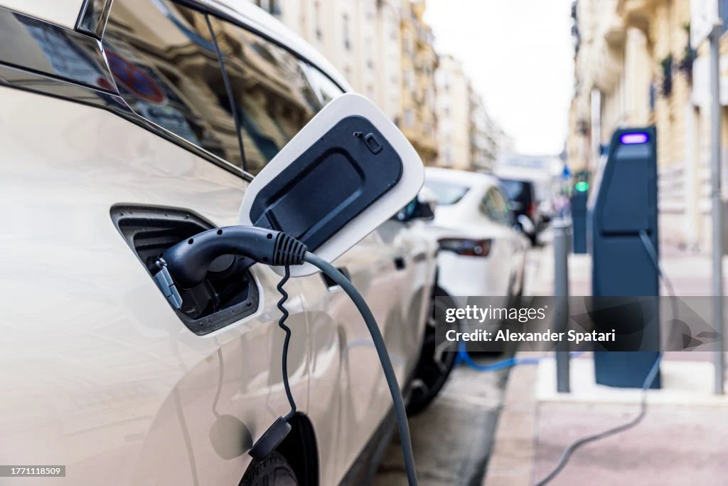 Electric car charging at the electric station on the street