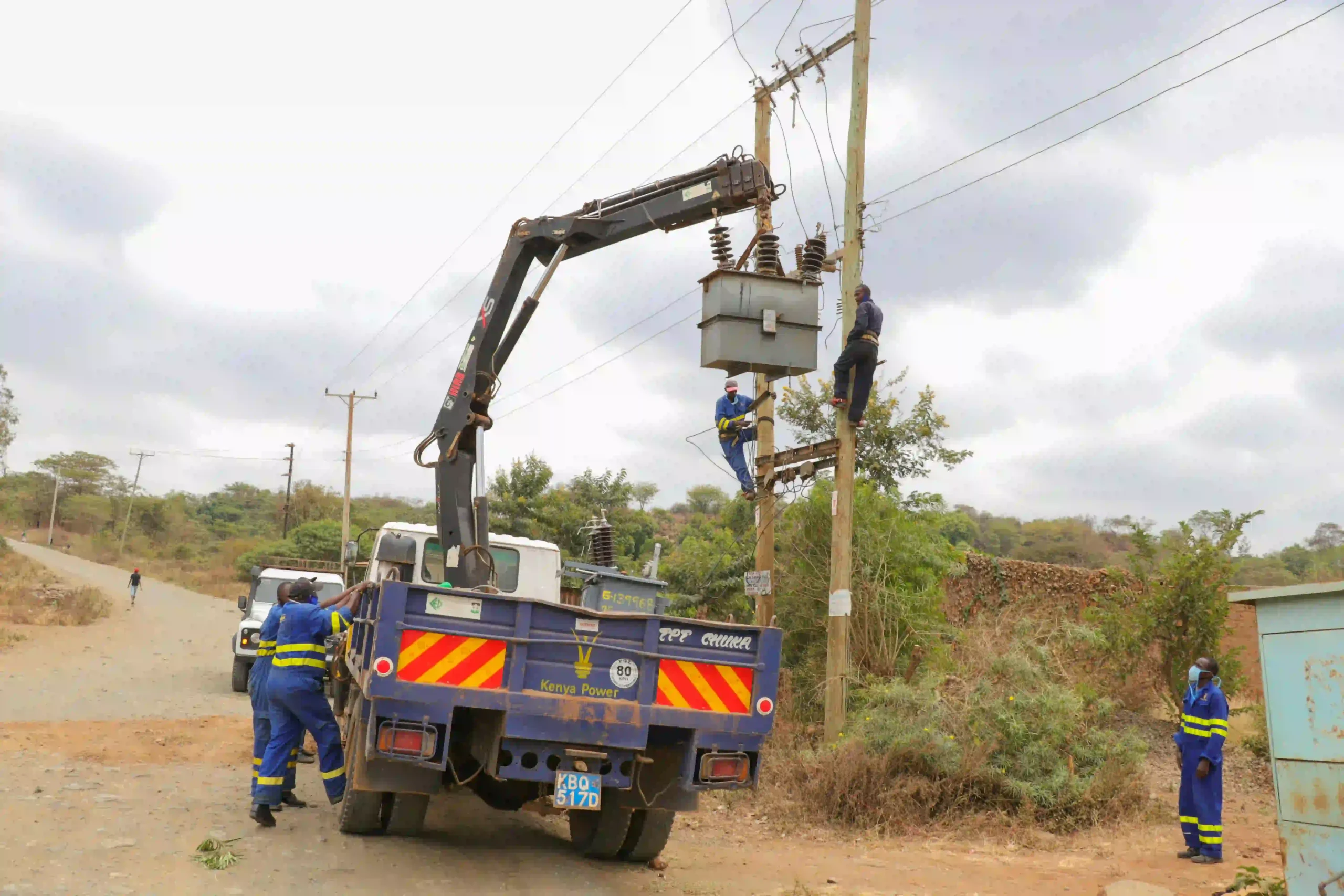 The pictures features Kenya Power Technical Team installing a transformer